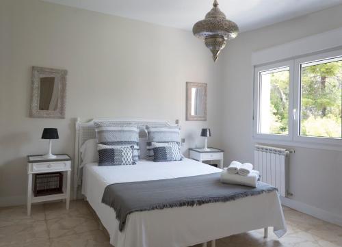 מיטה או מיטות בחדר ב-Malagueta Penthouse Premium