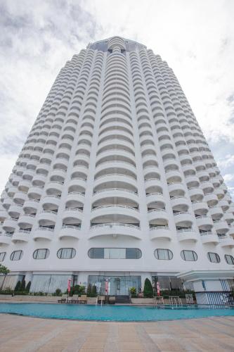 a large white building with a lot of windows at D Varee Jomtien Beach, Pattaya in Jomtien Beach