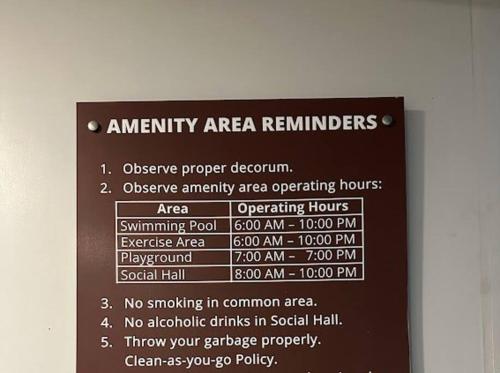 a sign that says emergency area reminders on a wall at Avida Tower 2 Mountain View Condominium in Davao City