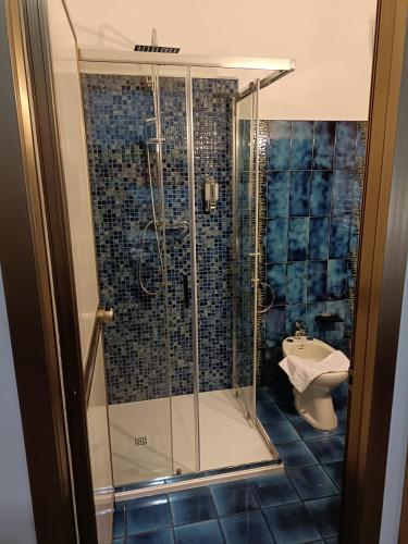 a bathroom with a shower and a sink at Hotel Alba Serravalle in Serravalle Pistoiese