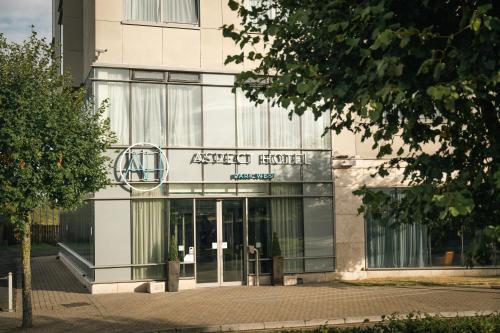 a building with a sign on the front of it at Aspect Hotel Park West in Clondalkin 