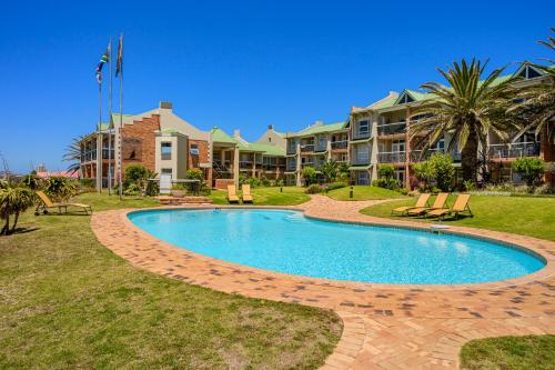 a swimming pool in front of a resort at 256 @ Brookes's in Summerstrand