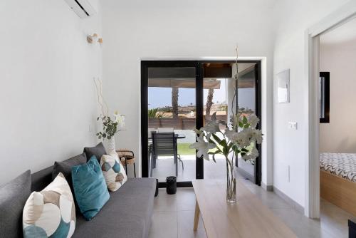a living room with a couch and a table at Casa Luna Kingbed and Jacuzzi in Maspalomas