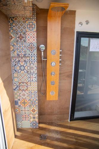 a room with a wall with tiles on it at Alojamientos Puerta Palma con vistas y Parking in Badajoz