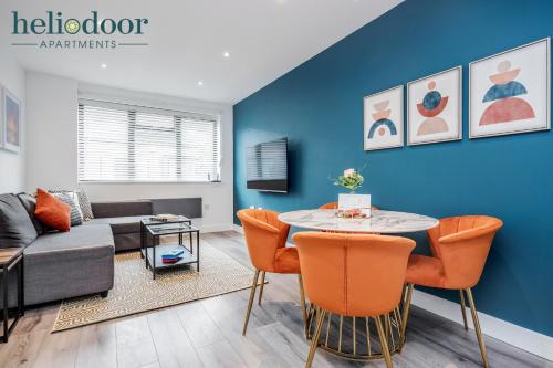 a living room with a couch and a table at HAL Heliodoor Apartments Milton Keynes, Free Parking, Free WiFi & Movies, 7-min drive to City Centre in Wolverton