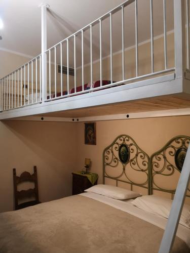 a bedroom with a bunk bed with a staircase at POGGIO ECO B&B in Ascoli Piceno