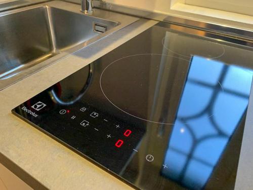 a close up of a microwave oven in a kitchen at Como Lake Crispi 7 Apartment in Como