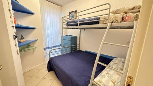 A bed or beds in a room at CA' DEI GELSI BEACH