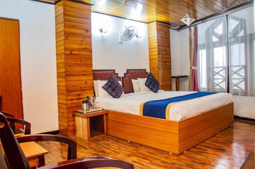 a bedroom with a bed in a room at Central Hill Resort The Mall Road in Gangtok