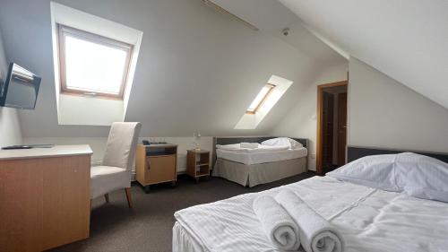 Un pat sau paturi într-o cameră la Hotel PAYER