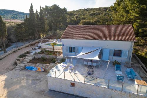 an aerial view of a house with a swimming pool at Holiday home with swimming pool - Dugi otok, Zman in Žman