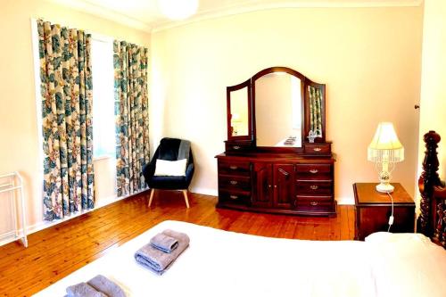 Кровать или кровати в номере Rose End Cozy Apartment