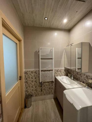 a bathroom with a sink and a mirror at Guest house, Jūrmala in Jūrmala