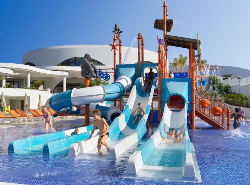 a group of people playing in a water park at H10 Atlantic Sunset Horizons Collection in Adeje