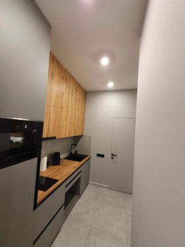a kitchen with a sink and a counter top at VIP studio in the center of Kyiv residential complex "Yaroslavov Grad" in Kyiv