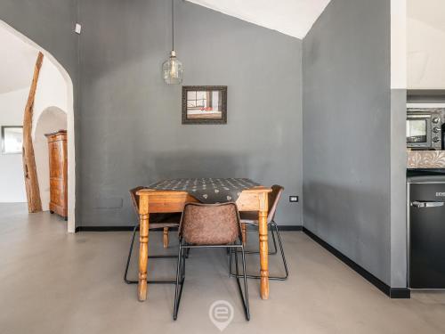 a dining room table and chairs in a kitchen at Spectacular Seaview Escape in Capitana