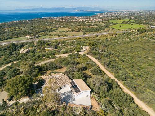 an aerial view of a house on a hill near the ocean at Spectacular Seaview Escape in Capitana