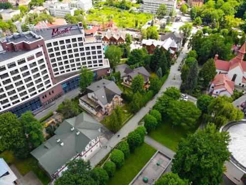 an aerial view of a city with buildings and trees at Hotel Sani in Truskavets