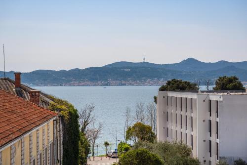 a view of a large body of water from a building at Miramare Hotel in Zadar