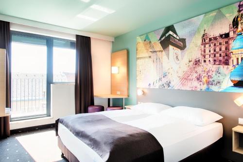 Postel nebo postele na pokoji v ubytování B&B Hotel Graz-Hbf