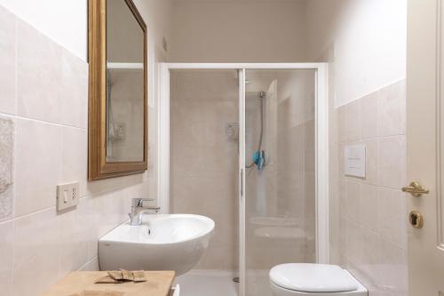 a bathroom with a shower and a sink and a toilet at B&B San Rocco in Capo di Ponte