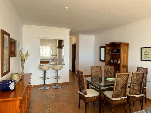 a dining room with a table and chairs at Nerja Paradise Rentals - Villa Dos Ardillas in Nerja