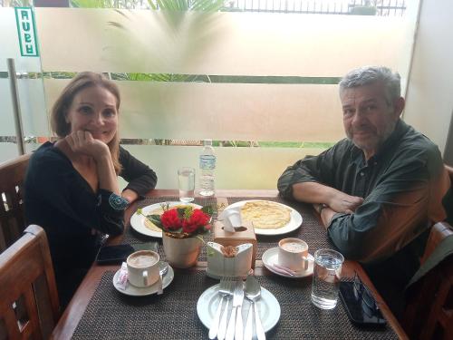 a man and a woman sitting at a table at Hotel Krishna Kathmandu in Kathmandu