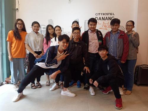 a group of people posing for a picture at City Hostel Da Nang in Da Nang