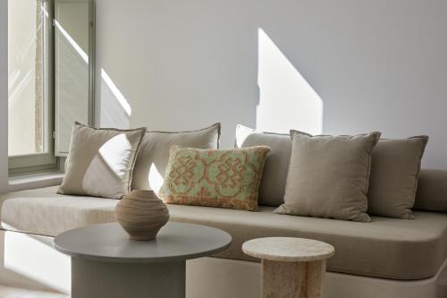 a living room with a couch and a table at Thiro Exclusive Villa with private jacuzzi in Pirgos