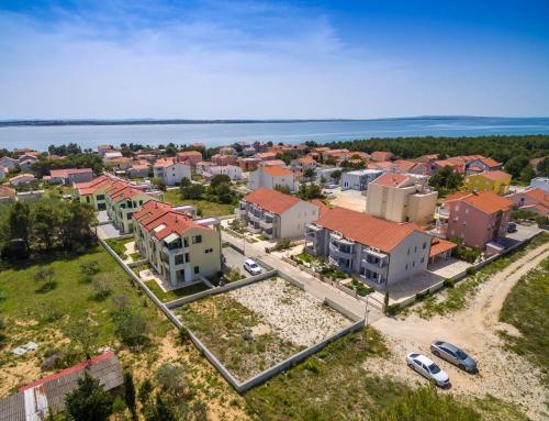 an aerial view of a town with houses and the water at Modern Apartment in Vrsi, 45 m², spacious terrace in Vrsi