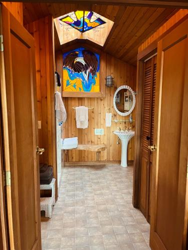 a bathroom with a sink and a mirror at Sanctuary Seaside in Eastsound