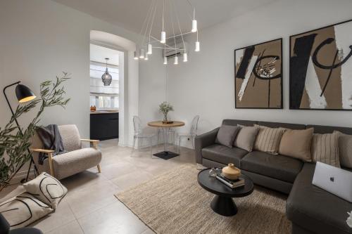 a living room with a couch and a table at Apartment Centro Pola in Pula