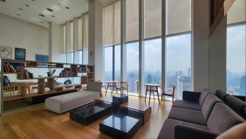 a living room with a couch and a table at KL Platinum KLCC 42 By SNC in Kuala Lumpur