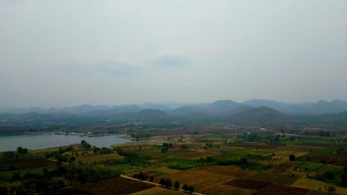 a view of a lake and mountains in the distance at ณ กาญโฮม NaKan Home in Ban Hin Hak