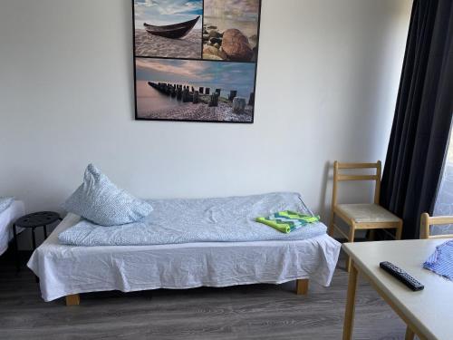 Säng eller sängar i ett rum på Kumpukuja apartment