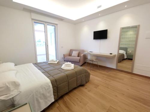 Ένα ή περισσότερα κρεβάτια σε δωμάτιο στο Villa Erada