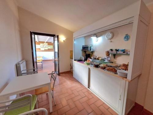 a kitchen with a counter with food on it at Butterfly in Bagnoregio