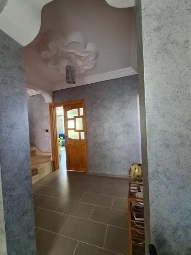 a hallway of a house with a ceiling at Dar Babou in Rabat