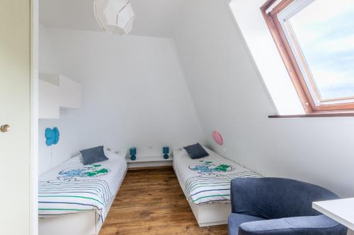 Ένα ή περισσότερα κρεβάτια σε δωμάτιο στο Eole - Appt avec vue mer