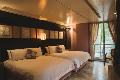 Una cama o camas en una habitación de 山也未央 宜蘭包棟Villa