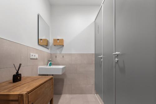 a bathroom with a shower and a sink at Flatista Homes - Aubing in Munich