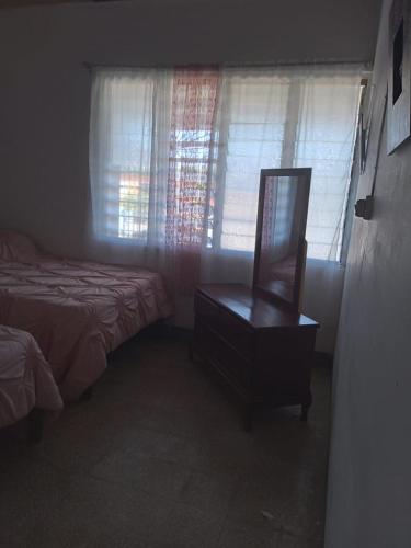 Postel nebo postele na pokoji v ubytování Belretiro Cottage