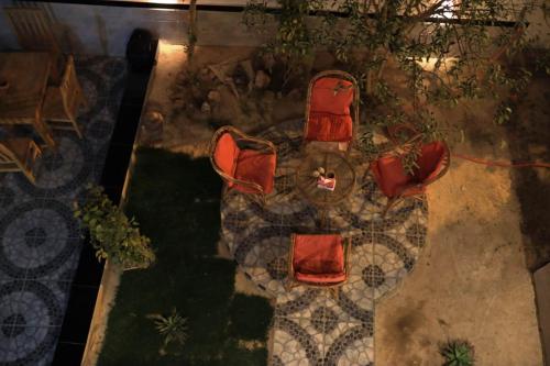 a group of chairs sitting on the ground at Happiness Guest House in Luxor