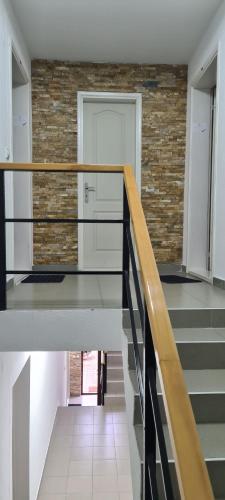 a staircase in a house with a brick wall at Vila Dubrovnik in Vrnjačka Banja