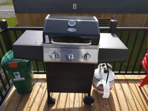 a grill sitting on top of a wooden deck at Subu's Paradise in Niagara in Niagara on the Lake