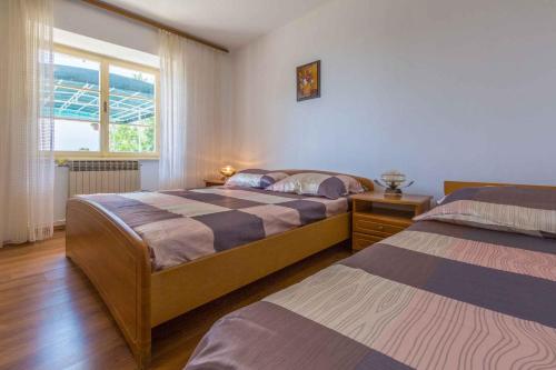 Voodi või voodid majutusasutuse Apartment in Dramalj 5753 toas