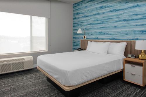 En eller flere senge i et værelse på TownePlace Suites By Marriott Dayton Wilmington