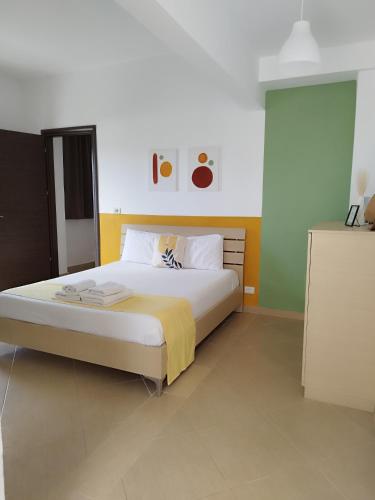 Postel nebo postele na pokoji v ubytování Iris Apartments Ksamil