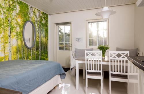 Ένα ή περισσότερα κρεβάτια σε δωμάτιο στο Villa Sofia Barösund