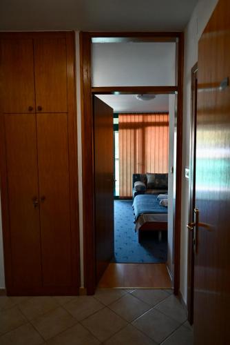 an open door to a living room with a couch at Marie in Krk